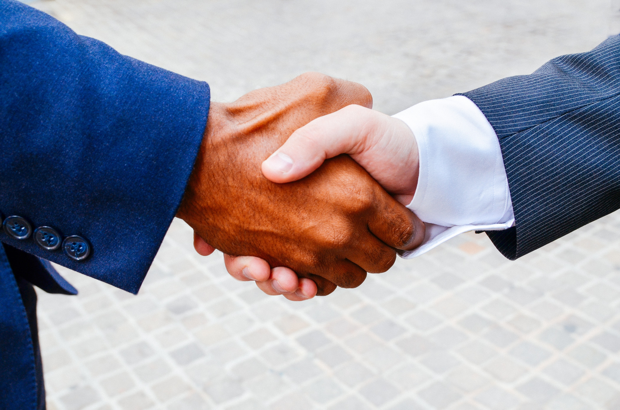 Close up of two business partners shaking hands